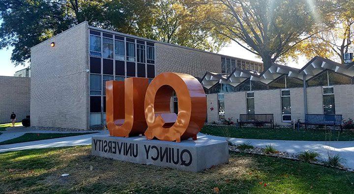 QU Sign in front of Helein Hall